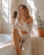 Woman holding the Bare Skin device